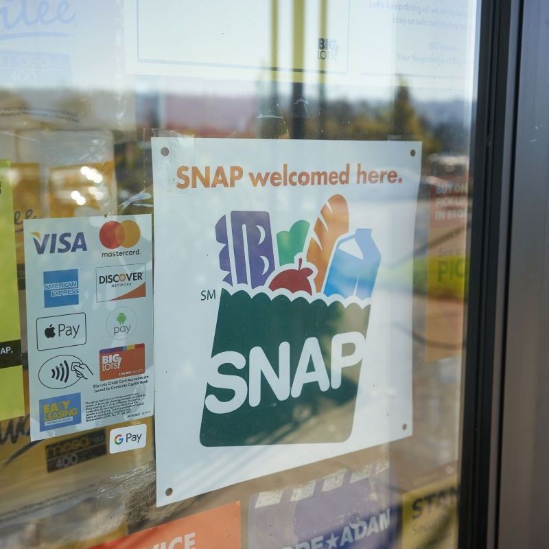 Sign in grocery store advertises that they take SNAP.
